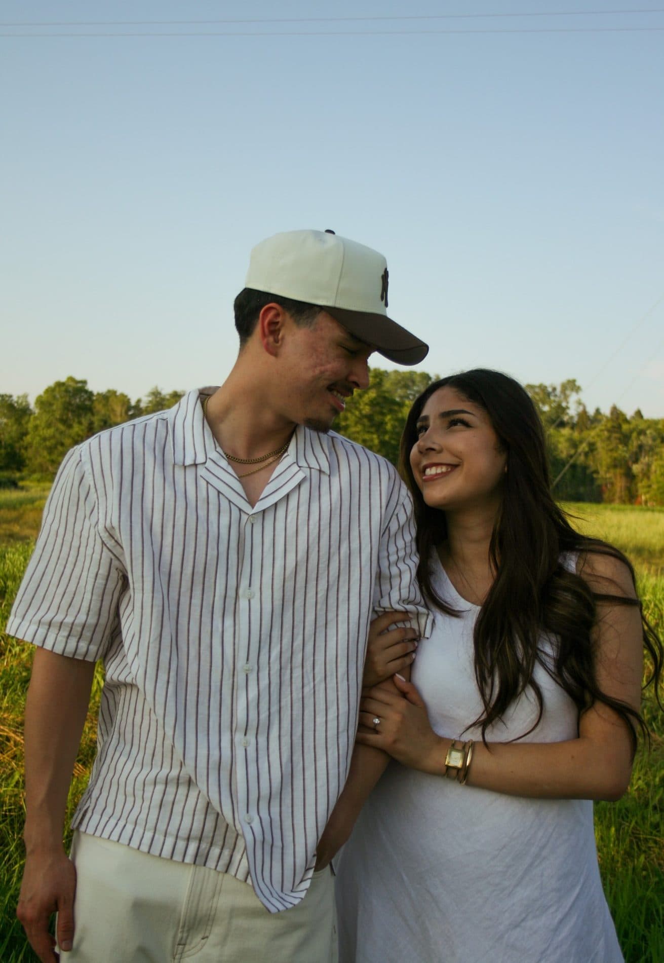 A couple standing together in soft evening light
